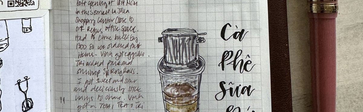 A journal page with a pink paper fan drawing, a sketched Vietnamese iced coffee, and Ca Phe Sua Da lettering